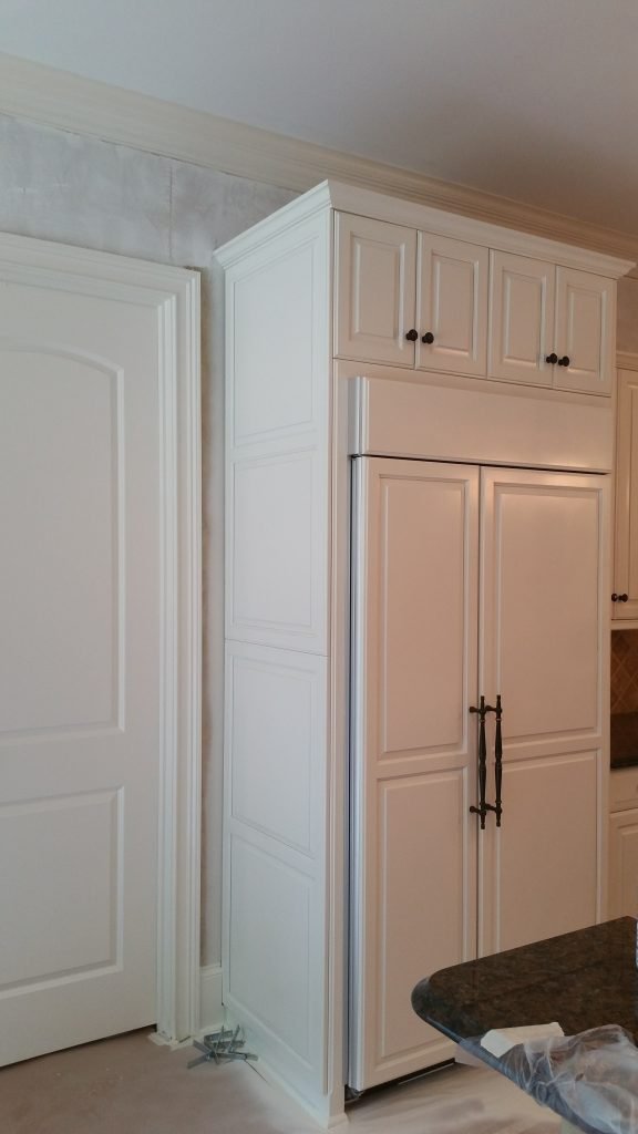 Beautifully painted kitchen cabinets by interior painting services in Charlotte, NC, featuring a clean and elegant design.