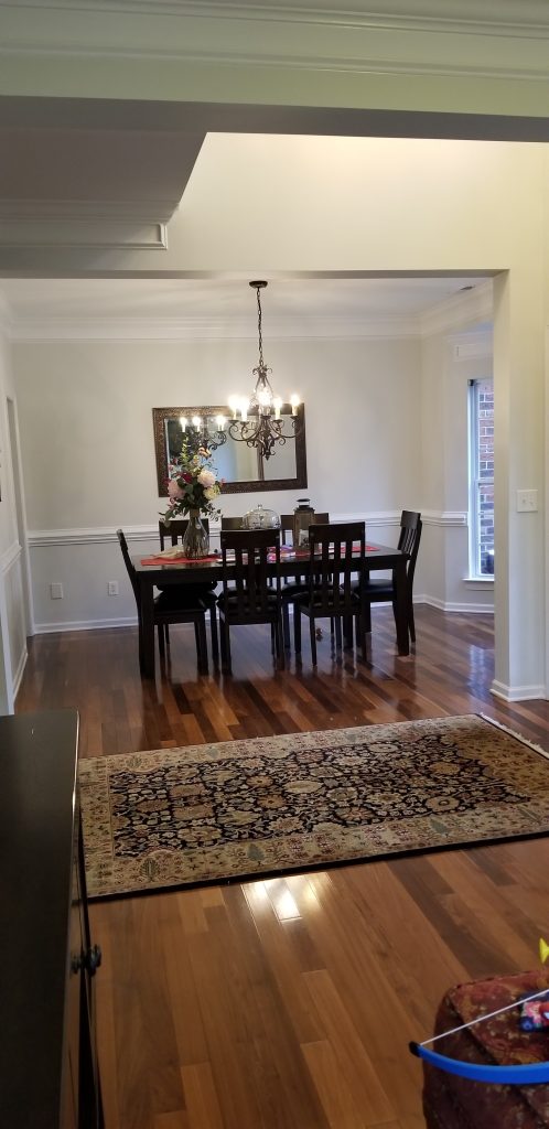 Elegant dining room with professionally painted walls and trim by a Painting Company in Indian Land, SC.